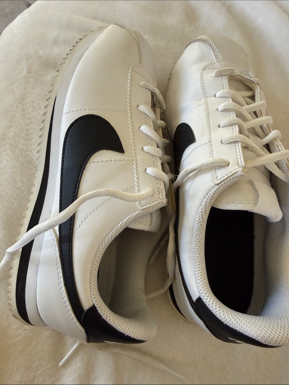 Nike big kids Cortez sneakers White with Black Swoosh
